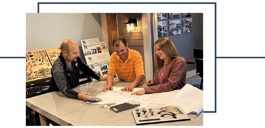 cowdin employee showing design process to two home owners