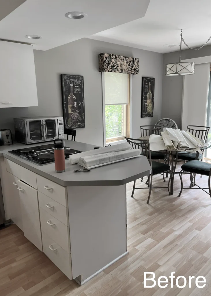 Existing kitchen island and adjoining dining space before remodeling.